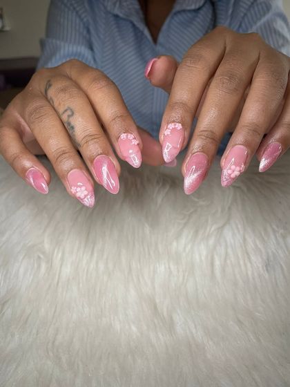 A dreamy pink cat eye set with delicate, scattered 3D floral details.