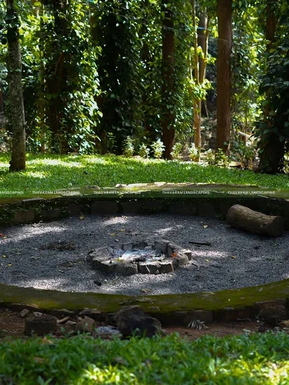 For this project in a wooded area, I designed a rustic, circular fire pit with a stone border, creating a natural gathering spot for evenings outdoors.