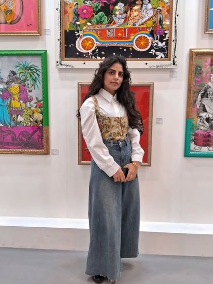 A duplicate of image 206, artist Beygumbano with her work.