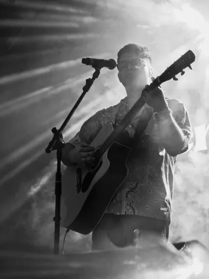 A powerful black and white shot from the Goa show. The dramatic lighting and smoke effects really added to the visual impact of our performance.