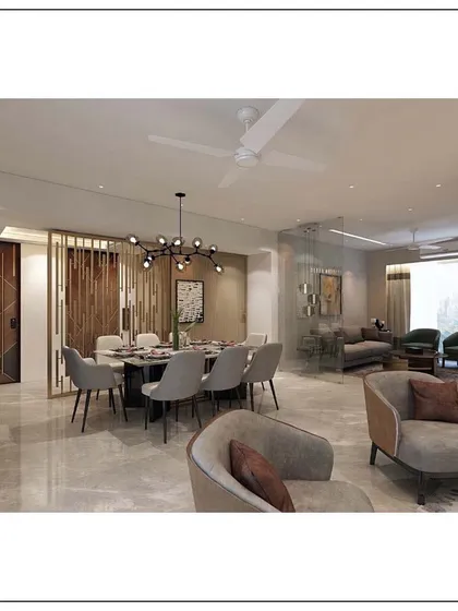 An example of modern eclectic design in a Mumbai apartment. The space cohesively blends different textures, a muted color palette, and distinct furniture pieces to create a living area that is warm, inviting, and full of character.