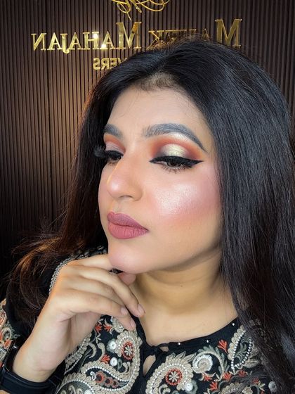 A close-up of the soft glam look, highlighting the glowing skin and sharp winged liner.