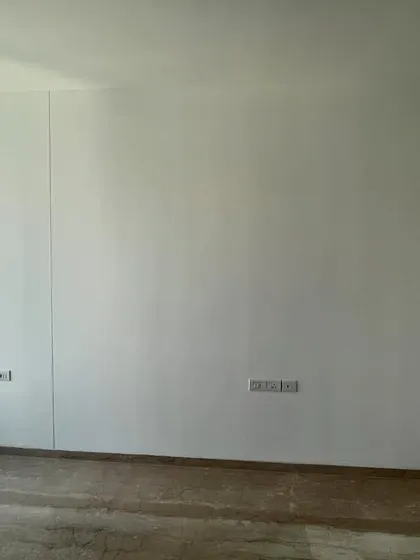 Another 'before' shot of the guest bedroom, showing the bare walls that we transformed.