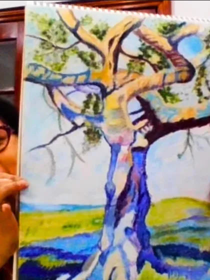 A student proudly displays her expressive tree painting, created during one of our live online sessions. Our goal is to help you find your unique style while mastering foundational art concepts.