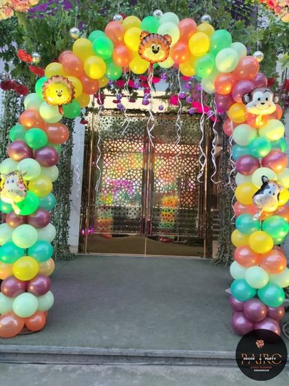 Another view of the jungle-themed balloon entrance arch. The bright colors and animal characters make it a fun and inviting entryway for a child's party.