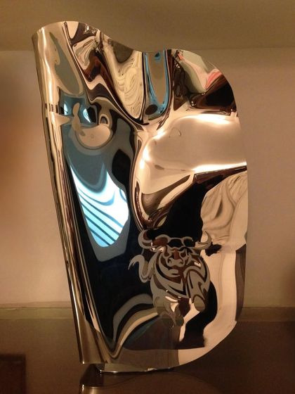 The full view of the "Bull Series I" sculpture, showcasing its strong, elegant form.