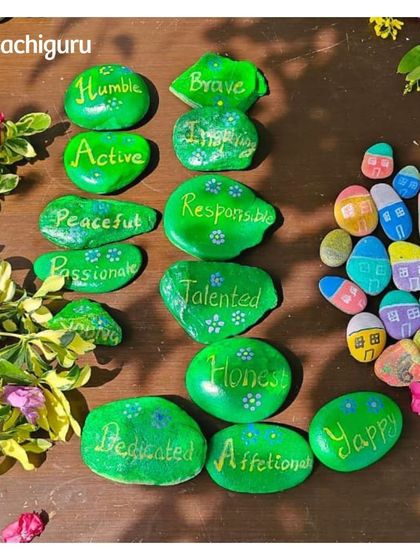 The family decorated for the birthday celebration by painting these beautiful pebbles with thoughtful messages. It's a wonderful example of sustainable and creative fun.