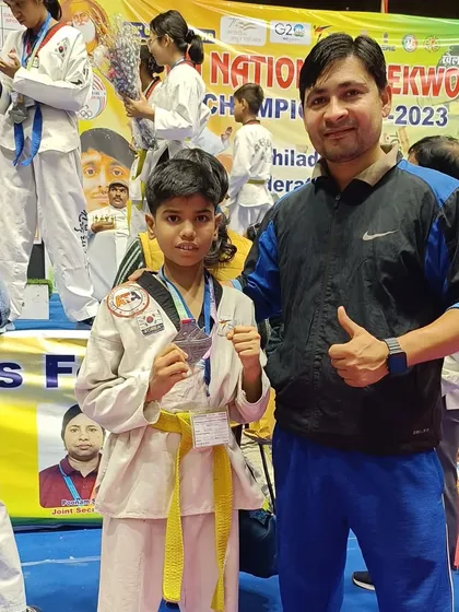 Posing with a student and her silver medal. I am proud of every single one of my students' efforts.
