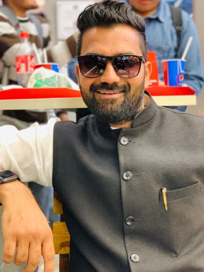 A candid smile while seated at a cafe. I believe that opportunities are not given, they are created through hard work and initiative.