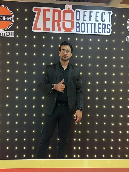 A thumbs-up in front of the IndianOil event backdrop, ready to deliver an exceptional show.