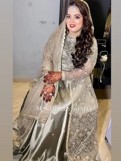 This bride's golden-grey outfit is so unique. I gave her a classic red lip to add a pop of color and complete the glamorous look.