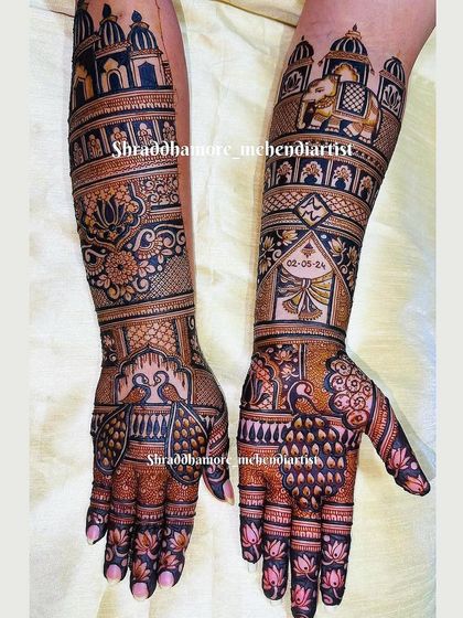 A personalized bridal mehendi with the wedding date beautifully incorporated. The design is rich with palace architecture, elephants, and floral motifs.