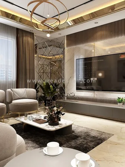 The formal living area at Vaishnavi Terraces, featuring a reflective gold ceiling, a mirrored accent wall, and plush, comfortable seating for a truly opulent feel.