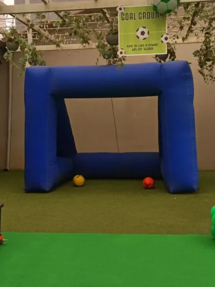 A clear view of the inflatable football goal setup on an artificial grass surface. This rental is a key feature for any sports-themed party, encouraging active play among the kids.