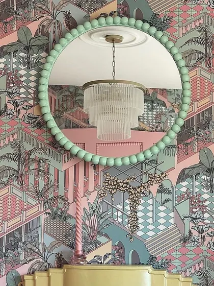 The Miami wallpaper from Cole & Son is presented in charming pastels and lush greens, evoking the timeless allure of mid-century Deco architecture and glamour that transitions seamlessly from day to night.