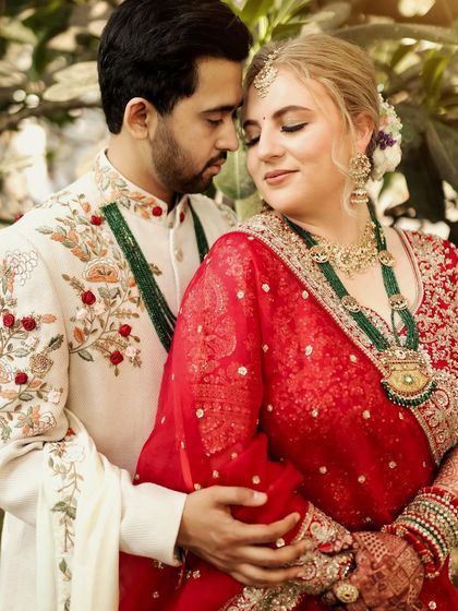 A beautiful, intimate portrait of a cross-cultural couple, showcasing their connection and stunning wedding attire.