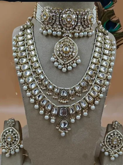 A layered Kundan set featuring a choker and a longer rani haar, perfect for a grand bridal look.