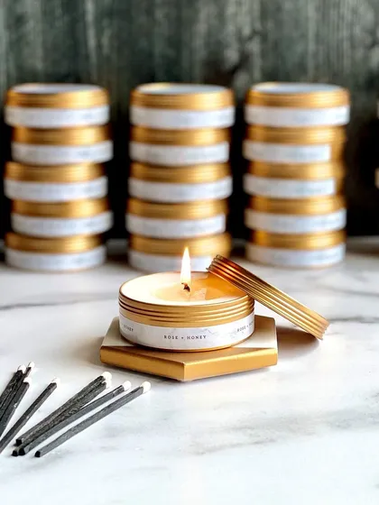 Stacks of our tin candles ready for a bulk order. They are easy to label, pack, and transport, making them ideal for large events.