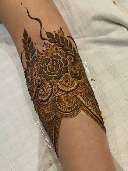 The armband after filling in the rose, creating a bold and beautiful contrast.