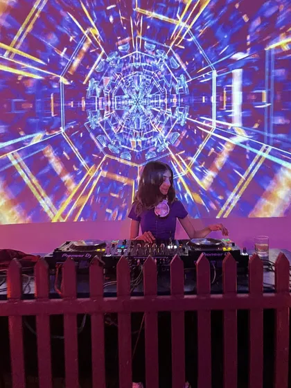 A closer shot from my gig at Cafe TC Dehradun, with the mesmerizing kaleidoscope visuals creating a tunnel effect behind me.