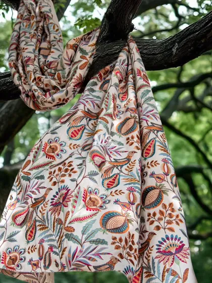 Our Ethereal Elegance fabric collection tells a story of skilled artistry. Woven from premium natural fibers, it features intricate handcrafted embroidery with vibrant florals and graceful birds, perfect for creating statement curtains or upholstery.