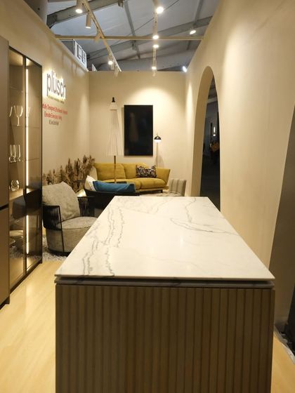 The view from the back of the Plüsch booth, looking through the arches towards the main display kitchen. This perspective shows how the design creates layered views and a sense of discovery.