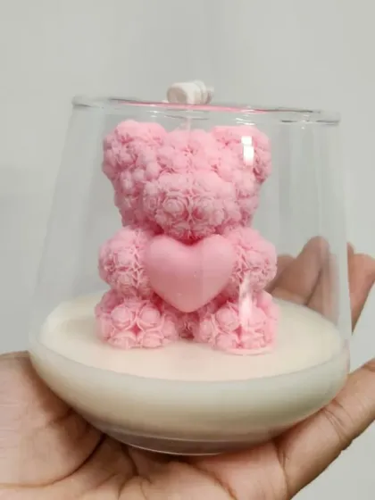 This is my pink teddy bear candle, a whimsical design perfect for gifting. The intricate rose-textured body and heart detail make it a charming addition to a nursery, a birthday gift, or a baby shower favor.