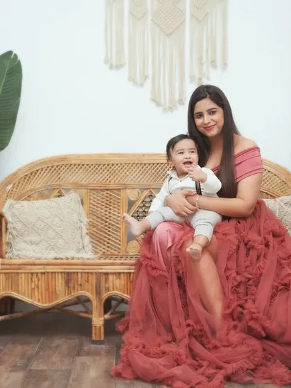 A mother and child portrait from our boho-themed studio setup. We offer a selection of beautiful gowns for moms to wear during the session.