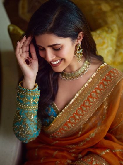 Another beautiful candid of Nimrat Kaur. The soft glam makeup allows her natural joy and beauty to be the focus.