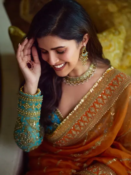 Another beautiful candid of Nimrat Kaur. The soft glam makeup allows her natural joy and beauty to be the focus.