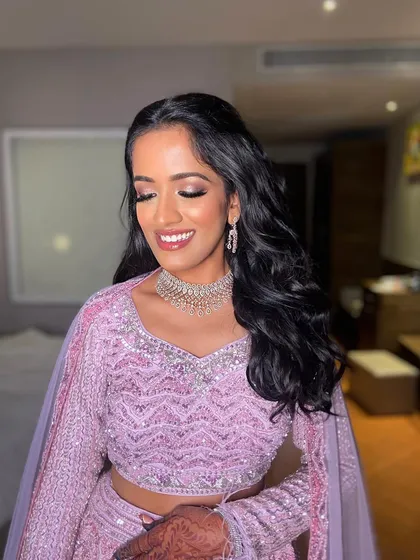 A close-up of Deepanshi's sangeet makeup, with her eyes closed to show the delicate shimmer and blending.
