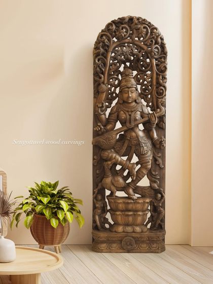 A full view of the majestic 72-inch Goddess Saraswati statue, shown in a home setting to provide a sense of its grand scale. This piece is perfect for institutions, large homes, or cultural centers.