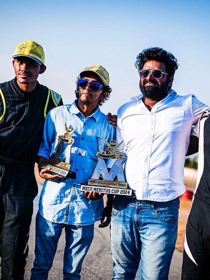The team celebrating a double podium finish on the track.