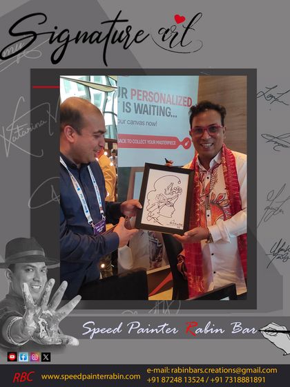 A guest at a Delhi event is thrilled with his Ganesha signature art. These pieces are very popular for their spiritual and artistic value.