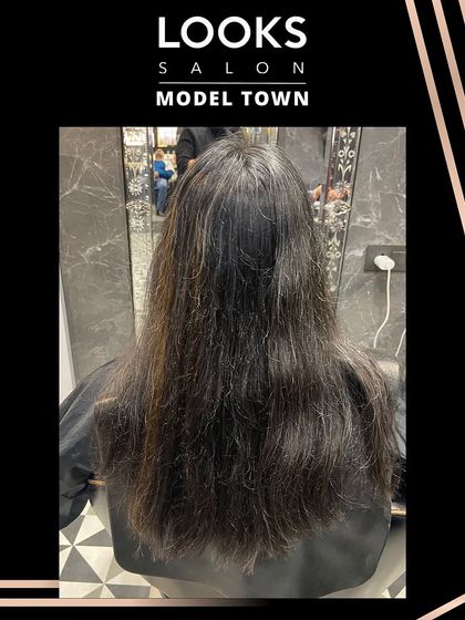 The initial state of the hair before the transformation, providing a dramatic contrast to the final look.