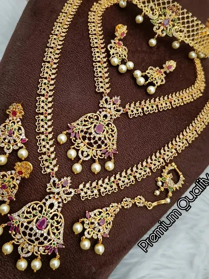 Another exquisite South Indian bridal combo set available for rent. This one features American diamonds and ruby-colored stones for extra sparkle.