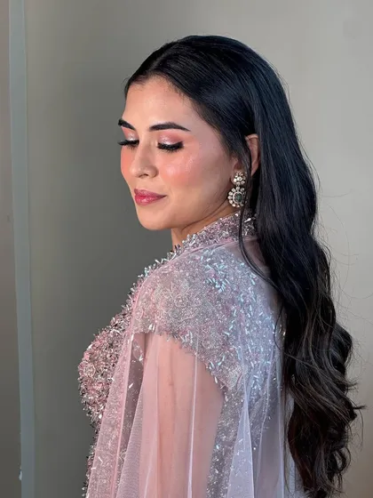 The soft pink and silver eyeshadow catches the light beautifully in this side profile. This sangeet look is all about ethereal shimmer.