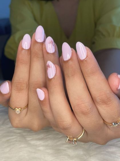 Another view of the lovely grape milk polish with delicate floral art.