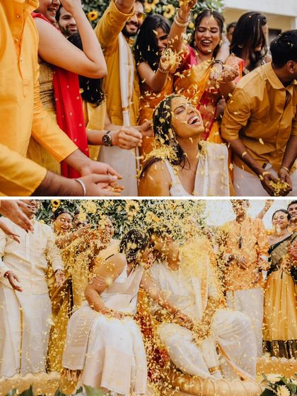 A shower of flower petals during the Haldi ceremony, creating a beautiful, celebratory moment of pure happiness.