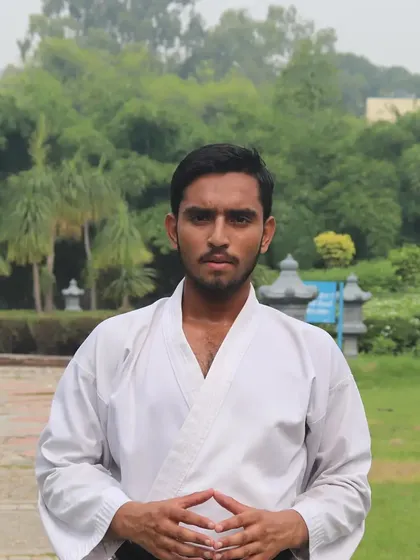A moment of focus before a training session in Chandigarh. Martial arts is also about mental discipline and finding calm through practice.