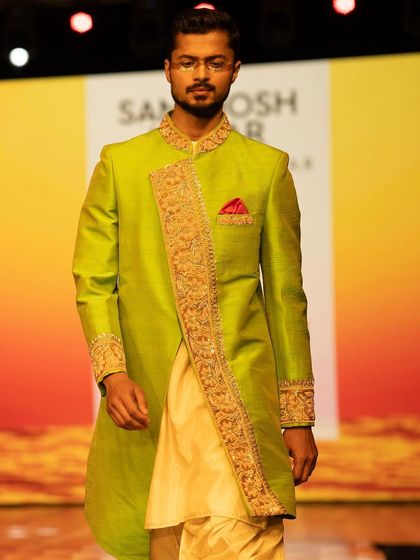 Detail shot of a designer sherwani on the ramp. My focus is always on presenting the garment's craftsmanship.