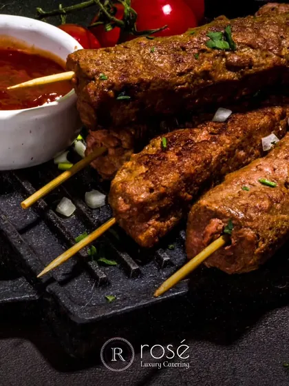 Juicy and flavorful seekh kebabs, fresh off the grill. This dish is a testament to our belief that the foundation of extraordinary cuisine lies in the quality of the ingredients and the skill of the chef.