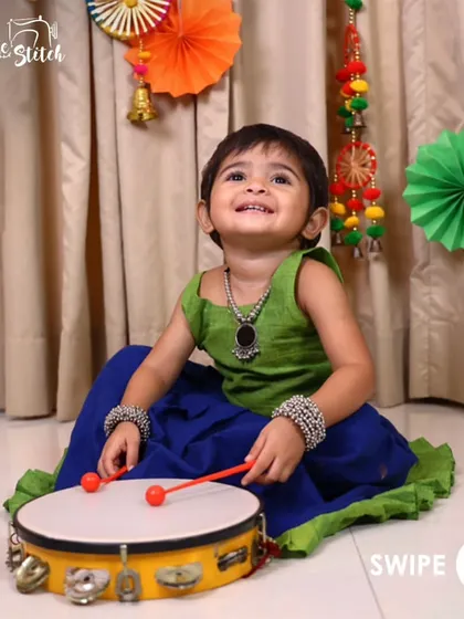 Another look at the playful Nila Ghagra Choli in green and blue. The bright smile on this little one's face is my biggest reward. It’s designed for fun, festive moments.