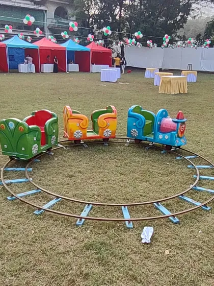 The mini train ride is a classic favorite for children's birthdays and family events. It runs on a simple track that I can set up on grass or a flat surface, offering a gentle and fun ride for the little ones.