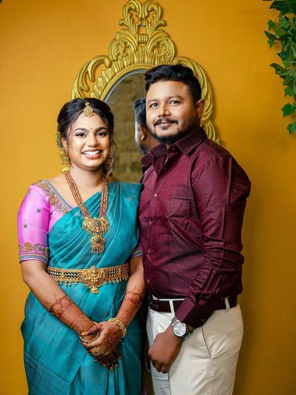 A happy portrait of the engaged couple. Sugirtha's makeup looks fresh and beautiful, capturing her joy on this special day.
