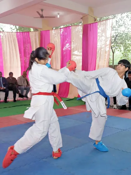 Real training is about applying your skills. Here, two of my students are engaged in a kumite (sparring) session during a championship. This is where technique, speed, and fighting spirit are tested on the mat.
