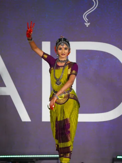 A senior student showcasing a beautiful mudra and serene expression. Her performance was recognized with a 2nd place award in her category.