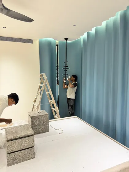 Our team carefully installing the custom light fixture. This is what our hands-on approach looks like.