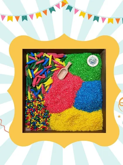 A beautiful sensory bin with brightly colored rice and pasta. These are perfect for developing fine motor skills and providing a calming, engaging activity.