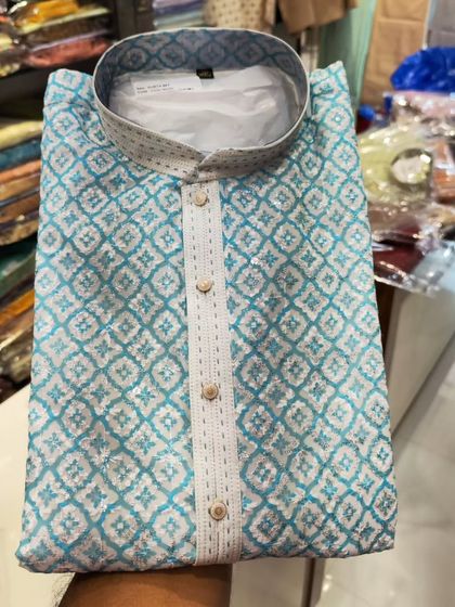 A folded view of a sky blue kurta with a white geometric print, part of my Diwali collection.
